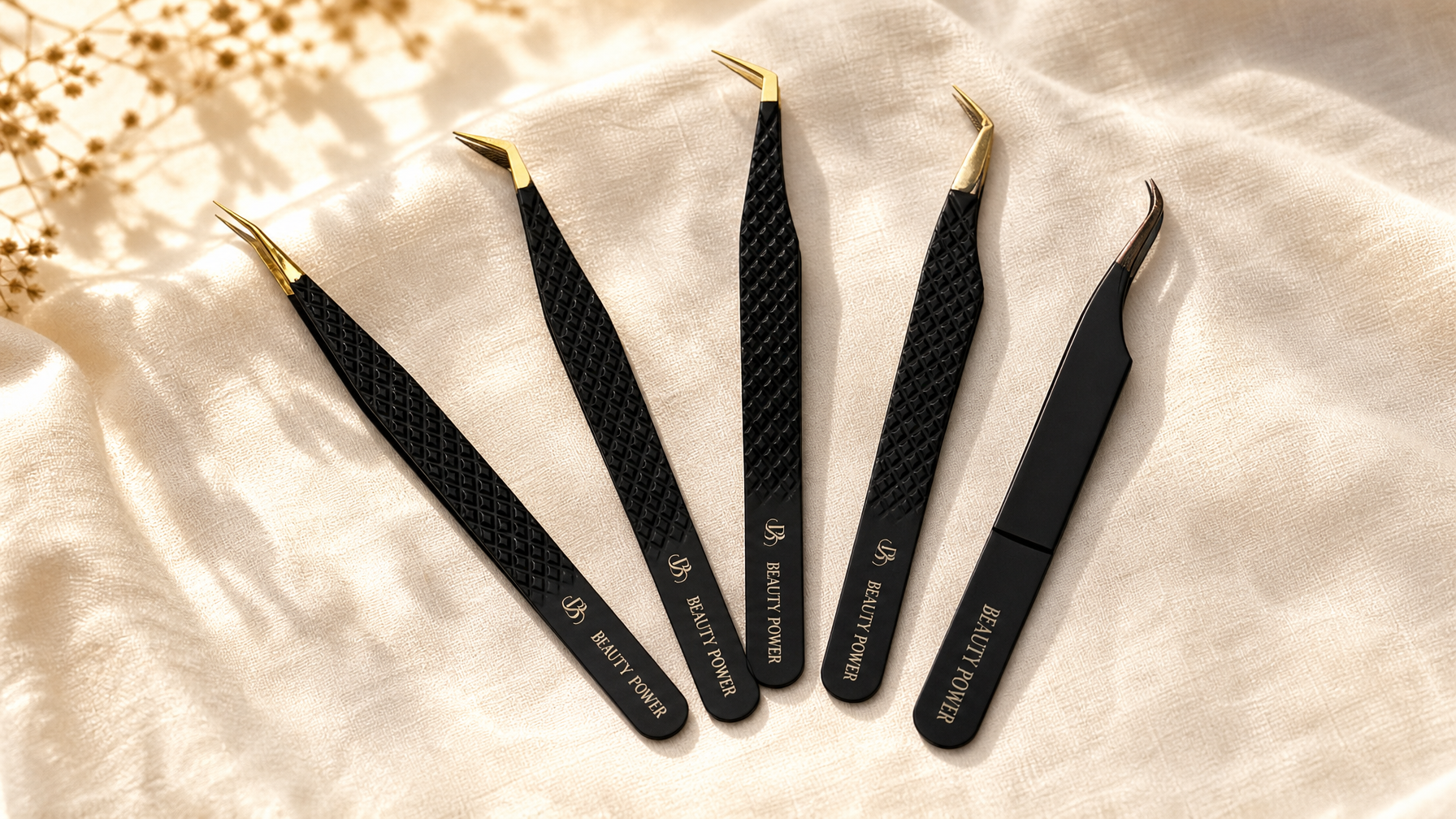Best lash extension tweezers 2026 — Beauty Power fiber tip tweezer collection flat lay