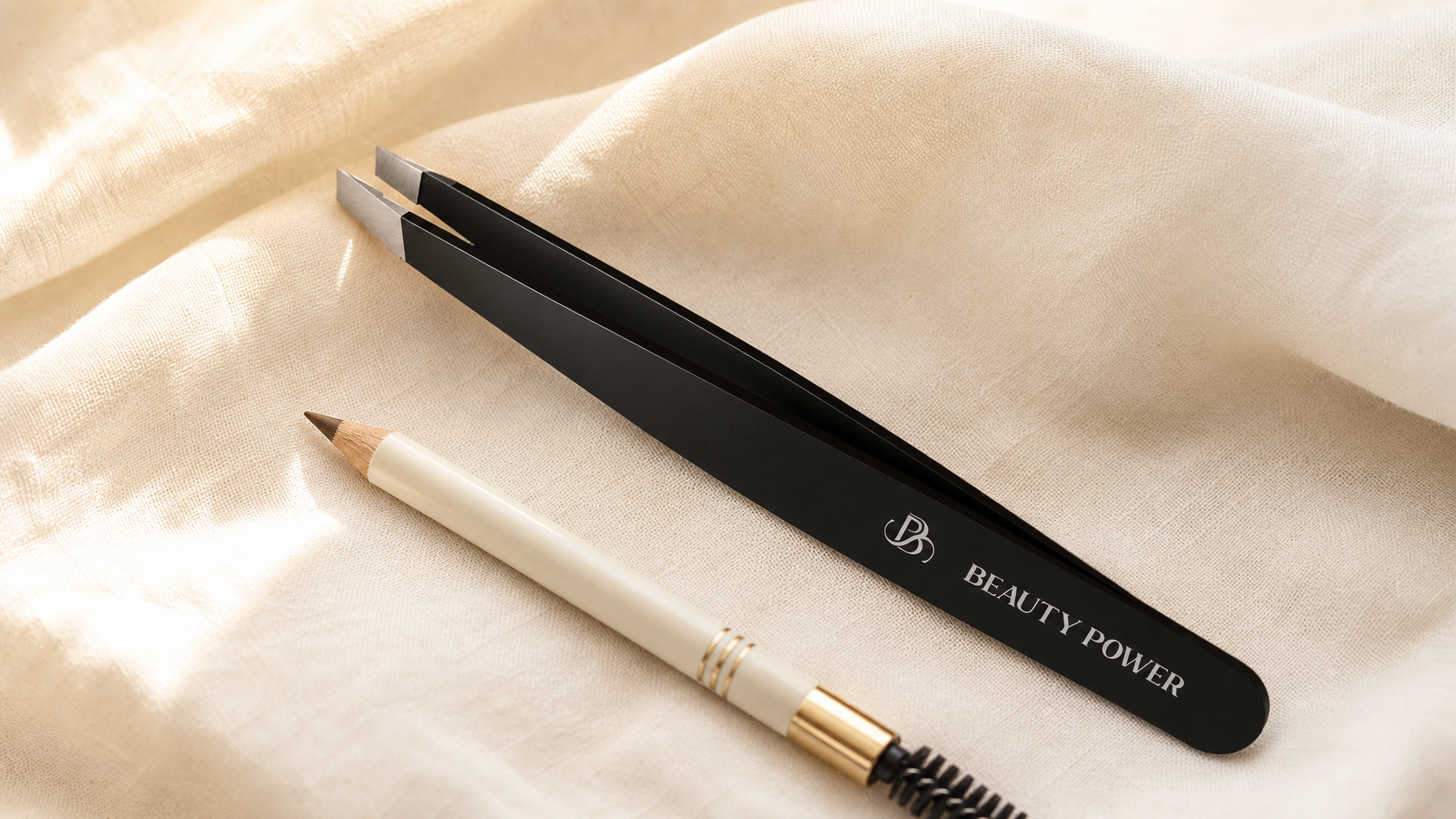How to shape eyebrows at home — Beauty Power precision tweezers and eyebrow mapping pencil on cream linen