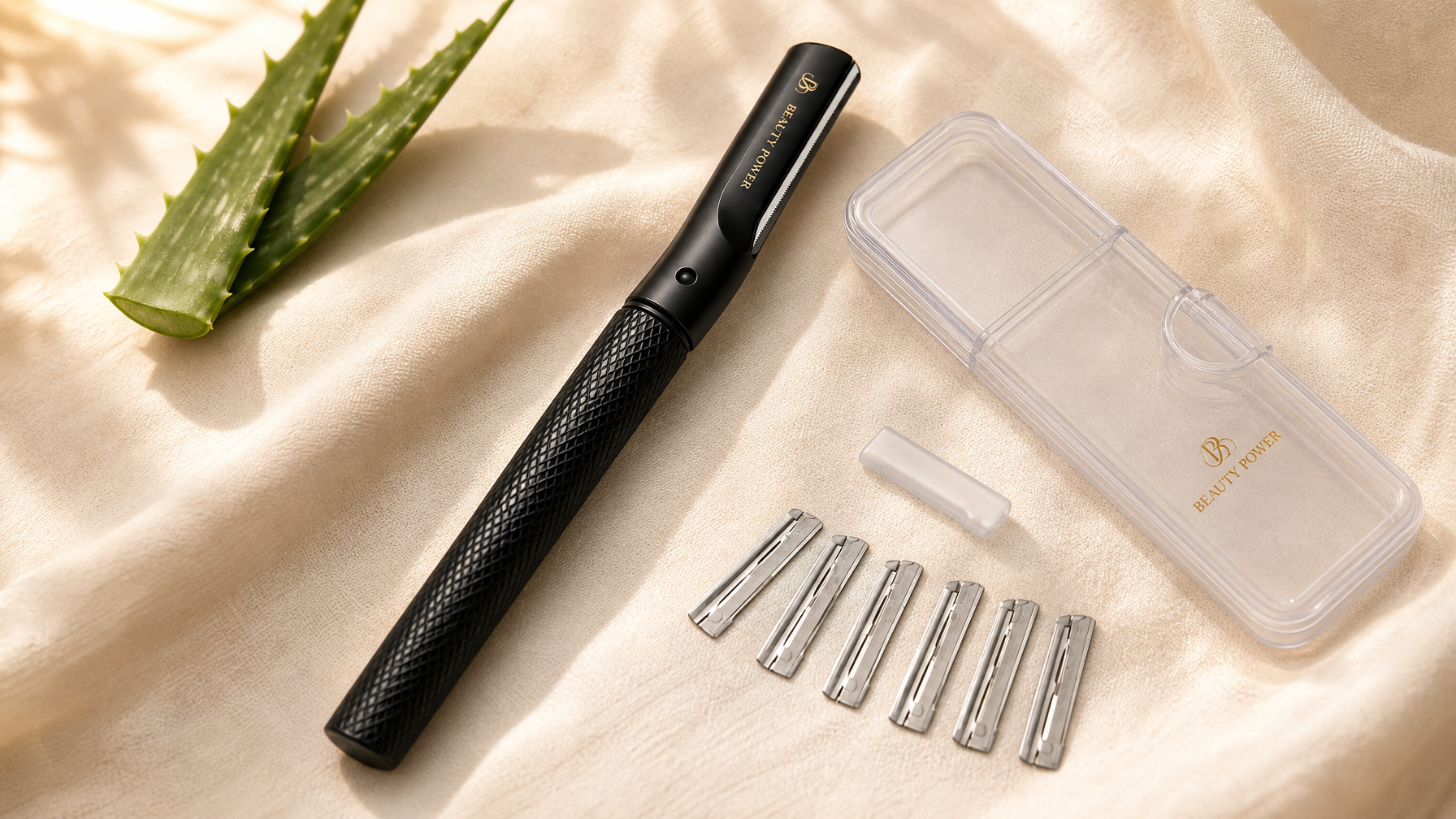 Beauty Power black dermaplaning razor with travel case and 6 replacement blades on cream linen — professional at-home dermaplaning tool