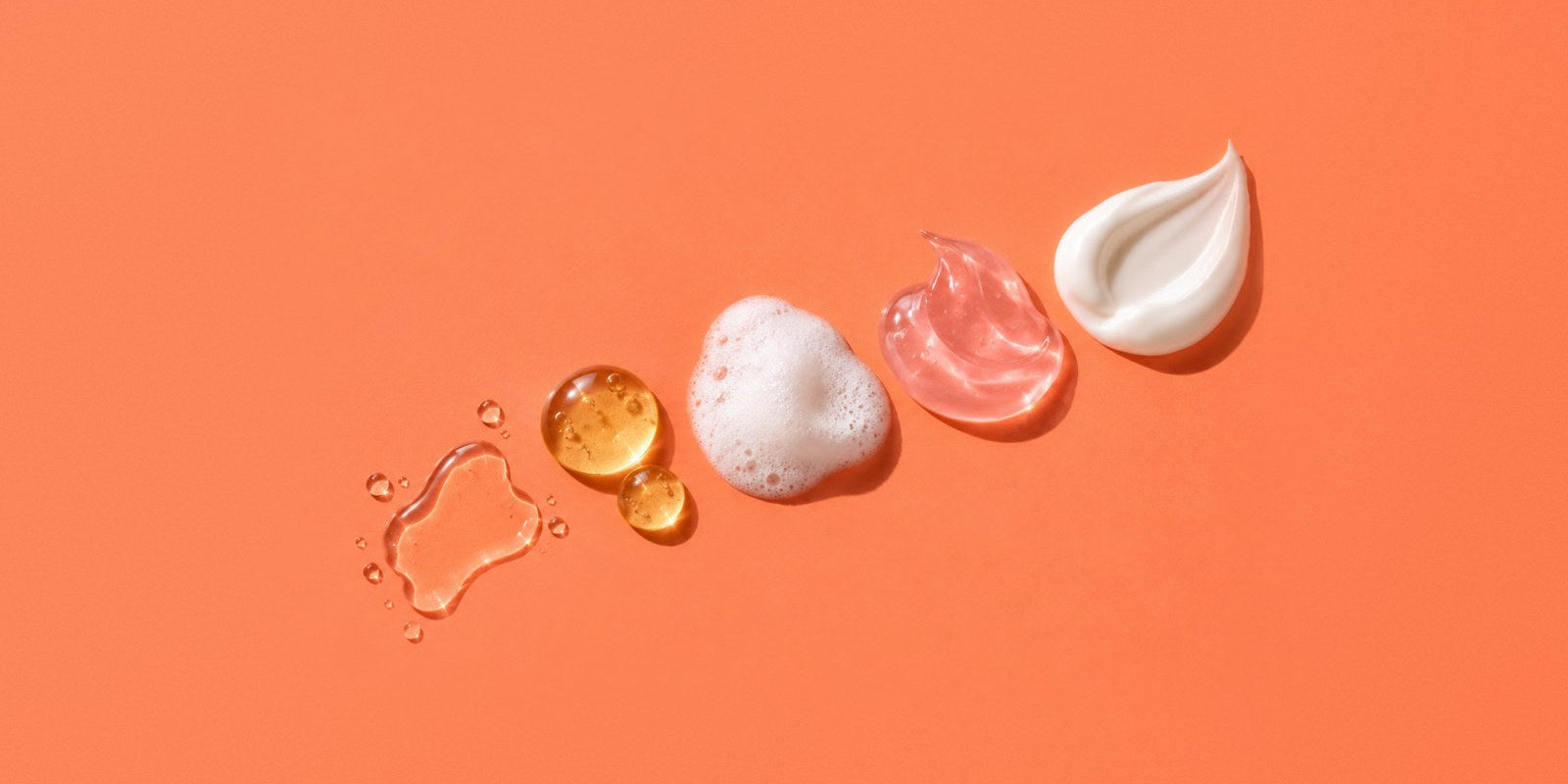 Korean skincare textures in layering order from thinnest to thickest: toner, ampoule drops, oxygen bubble foam, hydrogel jelly and cream